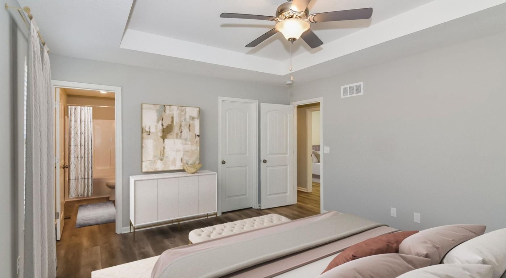 Sleep in style a bedroom with a bed and a fan