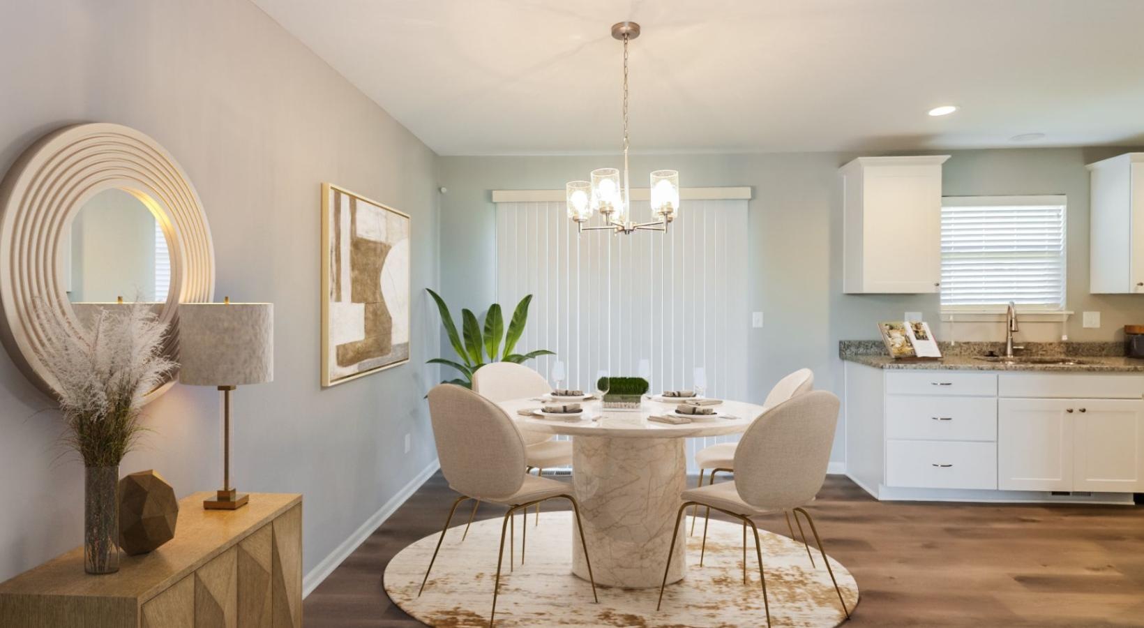 Wide open living areas perfect for entertaining a dining room with a chandelier and a table