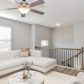 Generous living spaces to relax and unwind a living room with a white couch and a white table