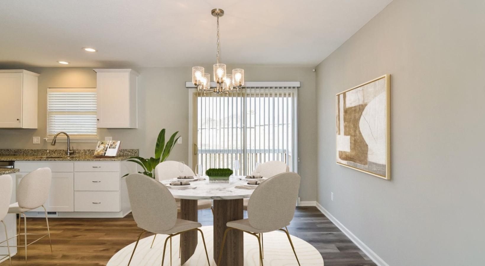 Wide open living areas perfect for entertaining a kitchen with a dining table and chairs