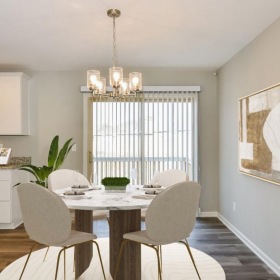 Wide open living areas perfect for entertaining a kitchen with a dining table and chairs