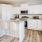 a kitchen with white cabinets